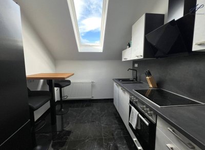 Modernisierte Dachgeschosswohnung mit Balkon &amp; Blick auf die Burgruine Kirchschlag