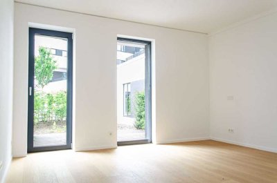 Helles Zweizimmerstudio mit Terrasse ins Grüne und Loggia mit Südausrichtung // Community-Spaces