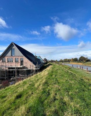Neubauwohnung mit 167m² Gesamtfläche am Deich in Moorrege – Wohnen mit Blick auf die Pinnau