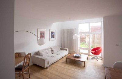 Helle Wohnung mit Terrasse und kleinem Garten
