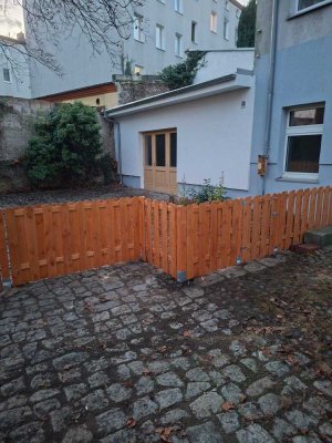 Genießen Sie das Flair einer bezaubernden Remise mit großzügiger Terrasse