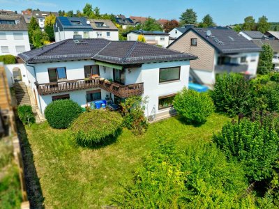 ZWEIFAMILIEN-WINKELBUNGALOW IN SONNIGER BLICKLAGE VON TAUNUSSTEIN-HAHN!