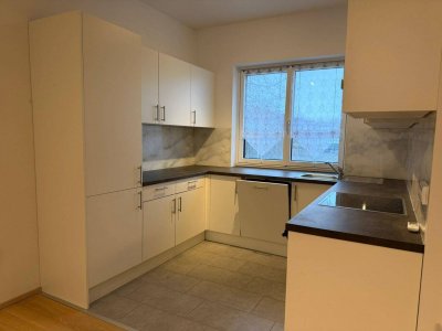 moderne 2 Zimmer Wohnung mit ostseitigem Garten, PV-Anlage, Klimagerät, E-Ladestation