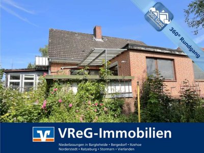 Vollunterkellertes Einfamilienhaus mit Einliegerwohnung und zwei Garagen