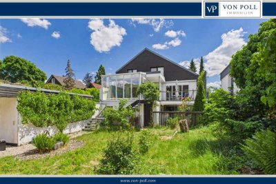 Freistehendes Mehrfamilienhaus mit variablen Nutzungsmöglichkeiten und Schwimmteich in Grünlage!