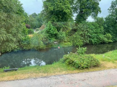 2‑Zimmer Dachgeschosswohnung mit Garten und Blick auf den Fluss!