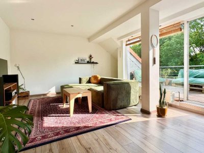 Charmante 2,5-Zimmer-Dachgeschosswohnung mit Loggia, Stellplatz und Blick ins Grüne
