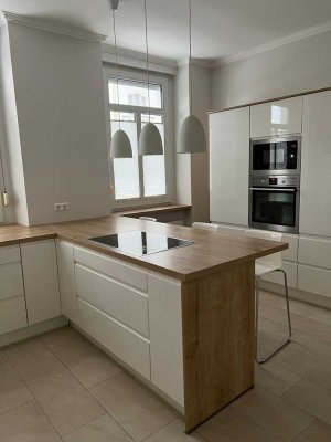 Hauscharakter Charmante 5,5-Zimmer-Altbauwohnung mit Einbauküche und großem Garten