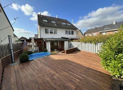Charmante Doppelhaushälfte mit Wintergarten, Garten und vielseitigen Nutzungsmöglichkeiten