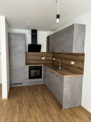 Charmante 2-Zimmer-Wohnung mit Terrasse, Garten & Tiefgaragenstellplatz