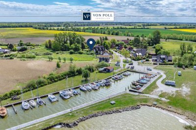 Tradition trifft auf Eleganz: Reetdachhaus mit separater Einliegerwohnung am Wasser
