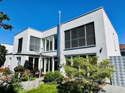 Architektonisches Juwel – Lichtdurchflutete Stadtvilla mit exklusivem Gartenflair