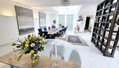 Zeitlose Architektur trifft Großzügigkeit - Designvilla mit Indoor-Pool und Einliegeroption
