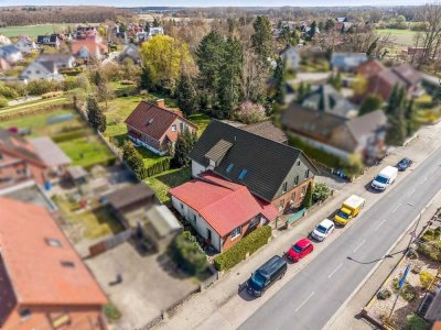 Wohnen und Nebenan vermieten! Einfamilienhaus, Mehrfamilienhaus und Baugrundstück in Harxbüttel