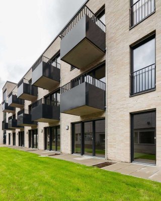 Neubau: 1-Zimmer-Wohnung mit Einbauküche, Terrasse und Stellplatz