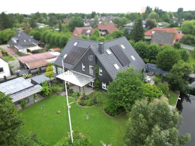 Exklusives Wohnen am Wasser: Einfamilienhaus in direkter Kanallage in Tholenswehr