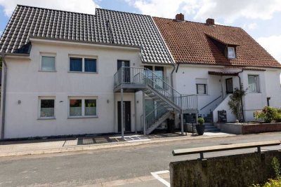RUDNICK bietet 3-Familienhaus mit Blick aufs Landschaftsschutzgebiet