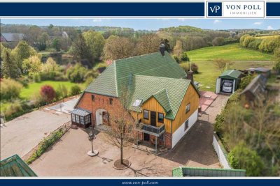 Großzügiges Mehrfamilienhaus mit Garten, Wintergarten und Garagen
