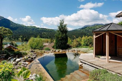 Wohnen, wo andere Urlaub machen – Haus am Weißensee mit Privatbadeteich