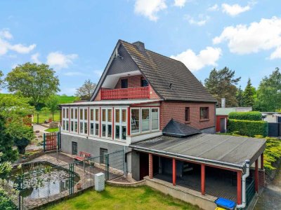 Familienidylle in Wallwitz – Gepflegtes Einfamilienhaus mit Wintergarten, Teich und gepflegten Garte