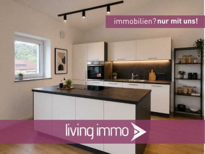 Zur Vermietung steht eine moderne Wohnung im energieeffizienten, KfW-40 Standard mit Carport