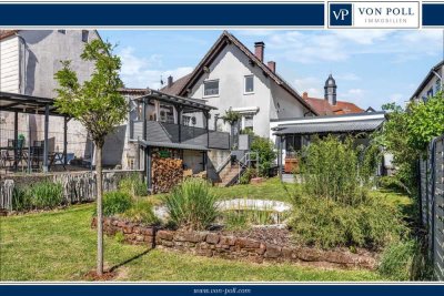 Modernisiertes Einfamilienhaus mit schönem Garten, PV-Anlage und 4 Garagenstellplätzen