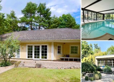Exklusives Wohnensemble mit Poolhaus in Waldlage