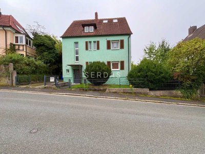 Attraktives Mehrfamilienhaus mit Garten in begehrter Wohnlage