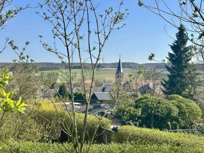 Wohnen im Grünen mit Weitblick – Ihr Traumhaus, naturnah und doch bestens angebunden!