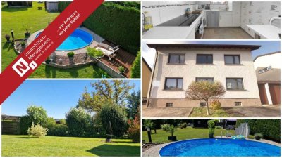 Topgepflegt und attraktiv gelegen - Zweifamilienhaus mit tollem Garten, 2 Garagen und Nebengebäude