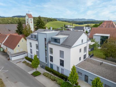 Stilvolle 2-Zimmer-Wohnung mit Sonnenterrasse & Tiefgarage – Wohnen in idyllischer Ortskernlage