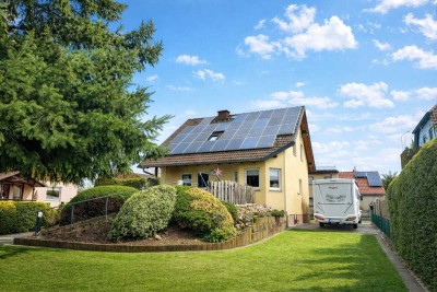 Familienglück im Grünen – gepflegtes Einfamilienhaus mit Kamin, großem Garten und Garage!