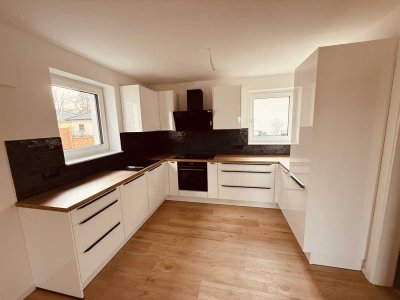 Neubau-Erstbezug: 3 Zimmer Terrassenwohnung in Hoppegarten mit Garten