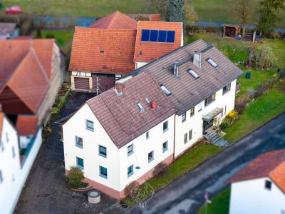 Wohn-/Geschäftshaus mit landwirtschaftlichem Anwesen in Hofheim/Rügheim