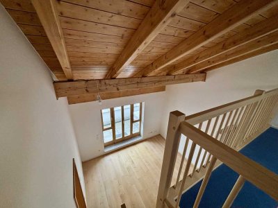 Stilvolle Maisonette mit großem Südbalkon, Tiefgaragenstellplatz und viel Charme