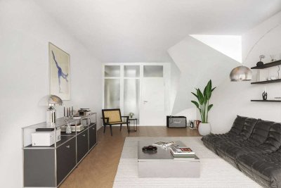 Wo München am lebendigsten ist. Haus-in-Haus-Charakter am Eisbach.
