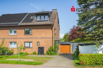 Teilmodernisierte Doppelhaushälfte mit Garten und Garage