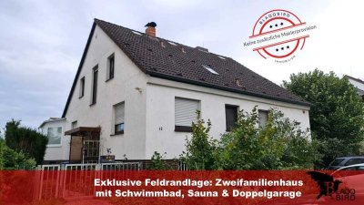 Exklusive Feldrandlage: Zweifamilienhaus mit Schwimmbad, Sauna & Doppelgarage
