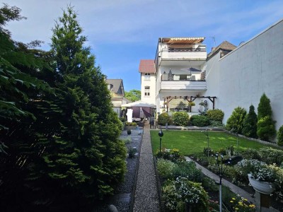 Boutique-Wohnung mit direktem Zugang zum privaten Garten.