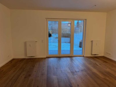 Schicke -4-Zimmer-Wohnung im Neubau mit Terrasse und Gartenanteil !