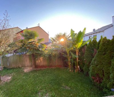 Schicke 3 Zimmer-Wohnung mit Terrasse und mediterran angelegtem Garten