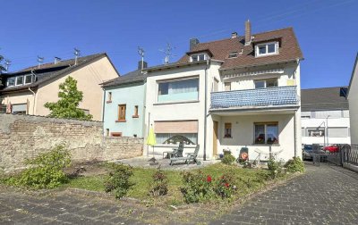 Dreifamilienhaus mit Garagen in Frankfurt-Sossenheim – Investitionsobjekt mit Potenzial