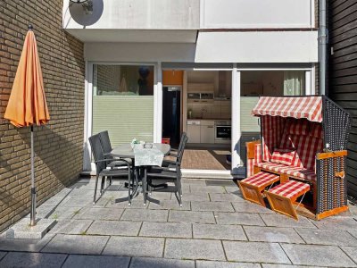 Hooksiel - Erdgeschosswohnung mit kleinem Südgarten, komplett ausgestattet, super Vermietungszahlen!