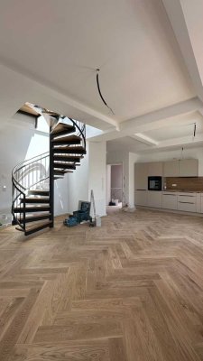 Erstbezug - stilvolle Penthousewohnung mit spektakulärer Dachterrasse & Blick über ganz München