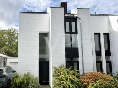 Einzigartiges Architektenhaus - Markante Doppelhaushälfte mit schönem Garten