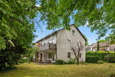 Renovierungsbedürftige Doppelhaushälfte mit großem Garten in bester Lage von Vaterstetten!
