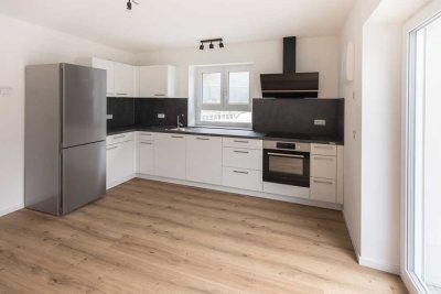 Erstbezug: Moderne 2,5-Zi-Wohnung EG mit EBK u. Garten