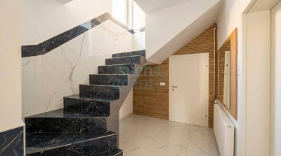 Modernisiertes Mehrfamilienhaus mit Balkon, Garten und Geschäftslokal