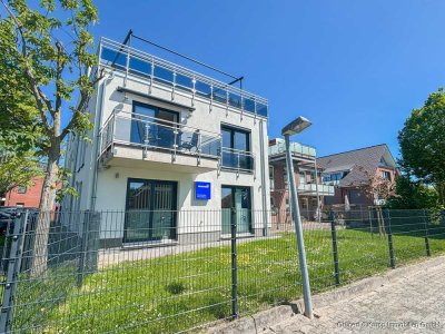 Zentral und strandnah - neuwertige 2-Zimmer-Wohnung mit Balkon, Stellplatz und Fahrradschuppen