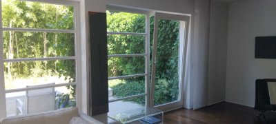 Moderne  2 Geschosswohnung mit Garten und Balkon